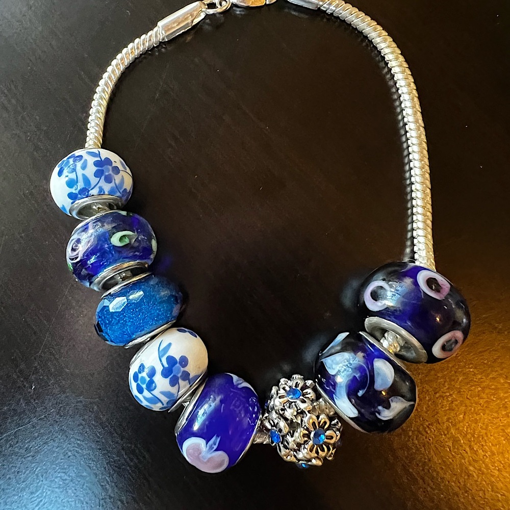 Beautiful sterling silver bracelet with beads. Fits size 7.5-8
